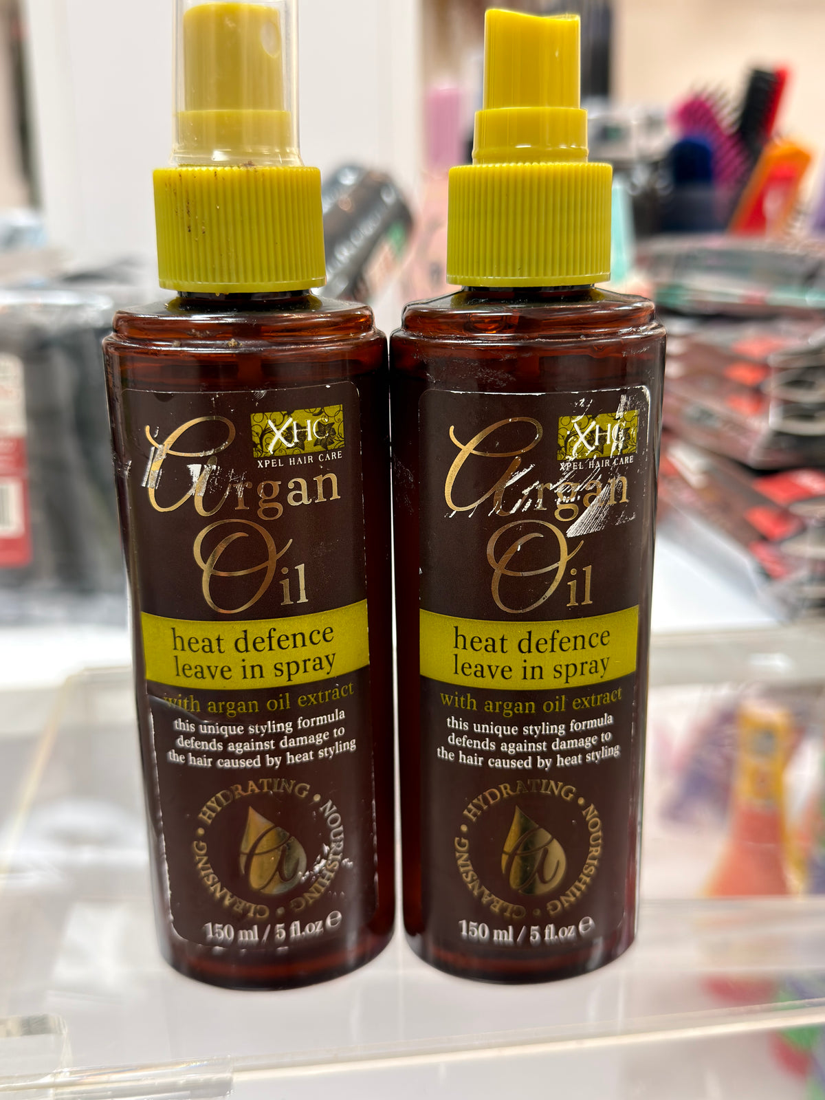 2 Bottles Of XHC Argan Oil Heat Defense Leave In Hair Spray